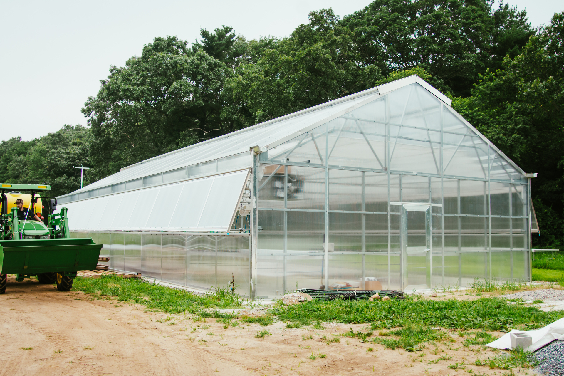 the exterior of Moose Hill's new greenhouse, under construction at the time the picture was taken