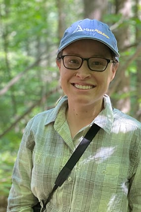 stephanie kane smiling with a mass audubon hat on