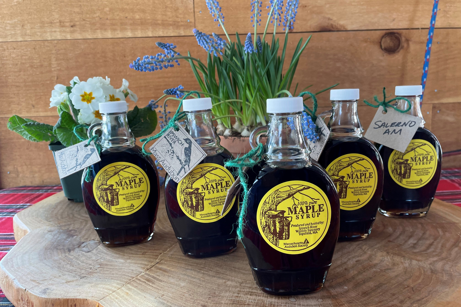 Bottles of maple syrup on a table