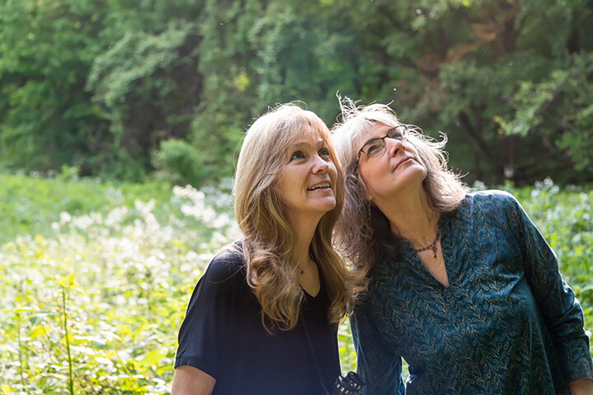 Two people looking at something off camera