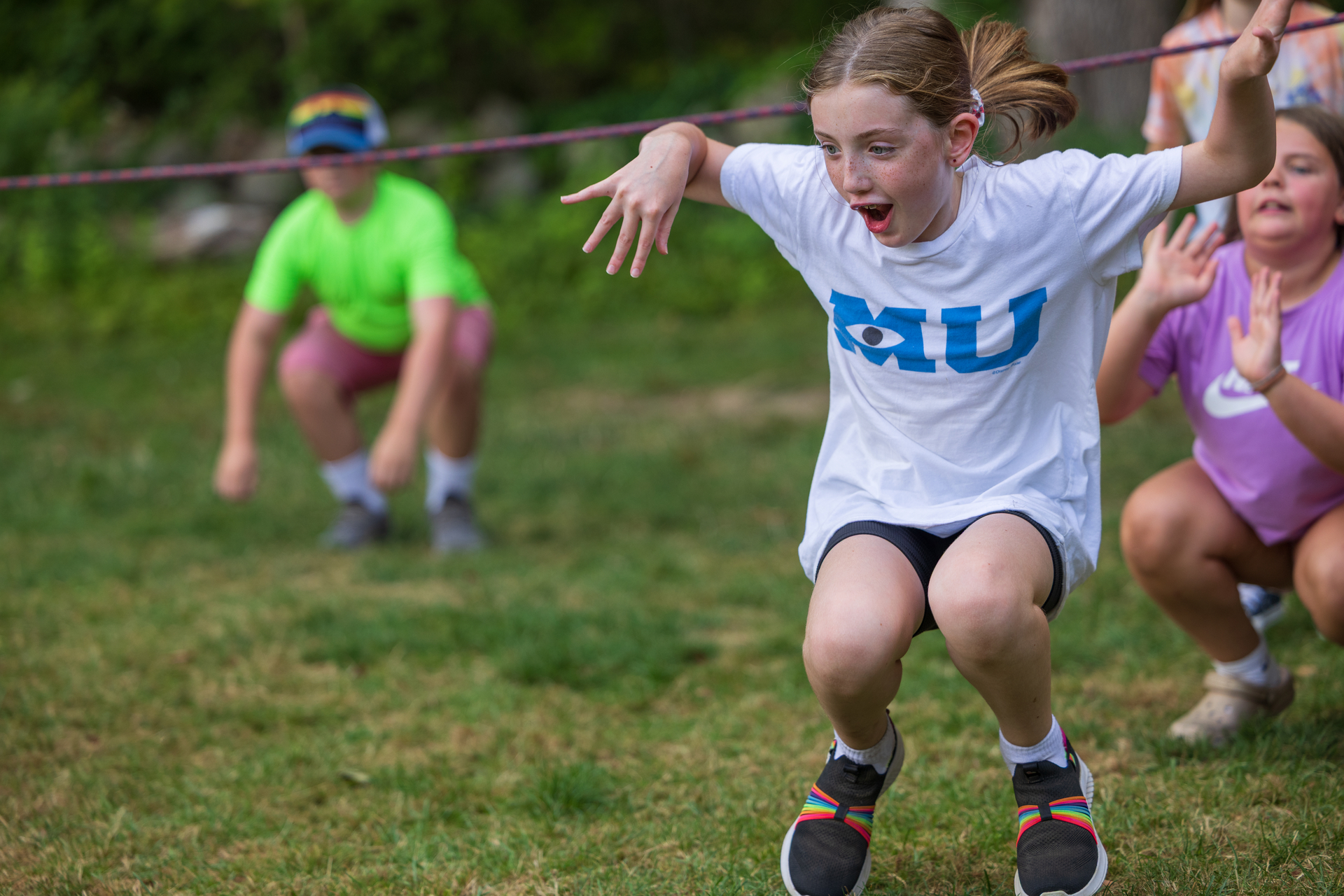 camper jumps in the air in excitement
