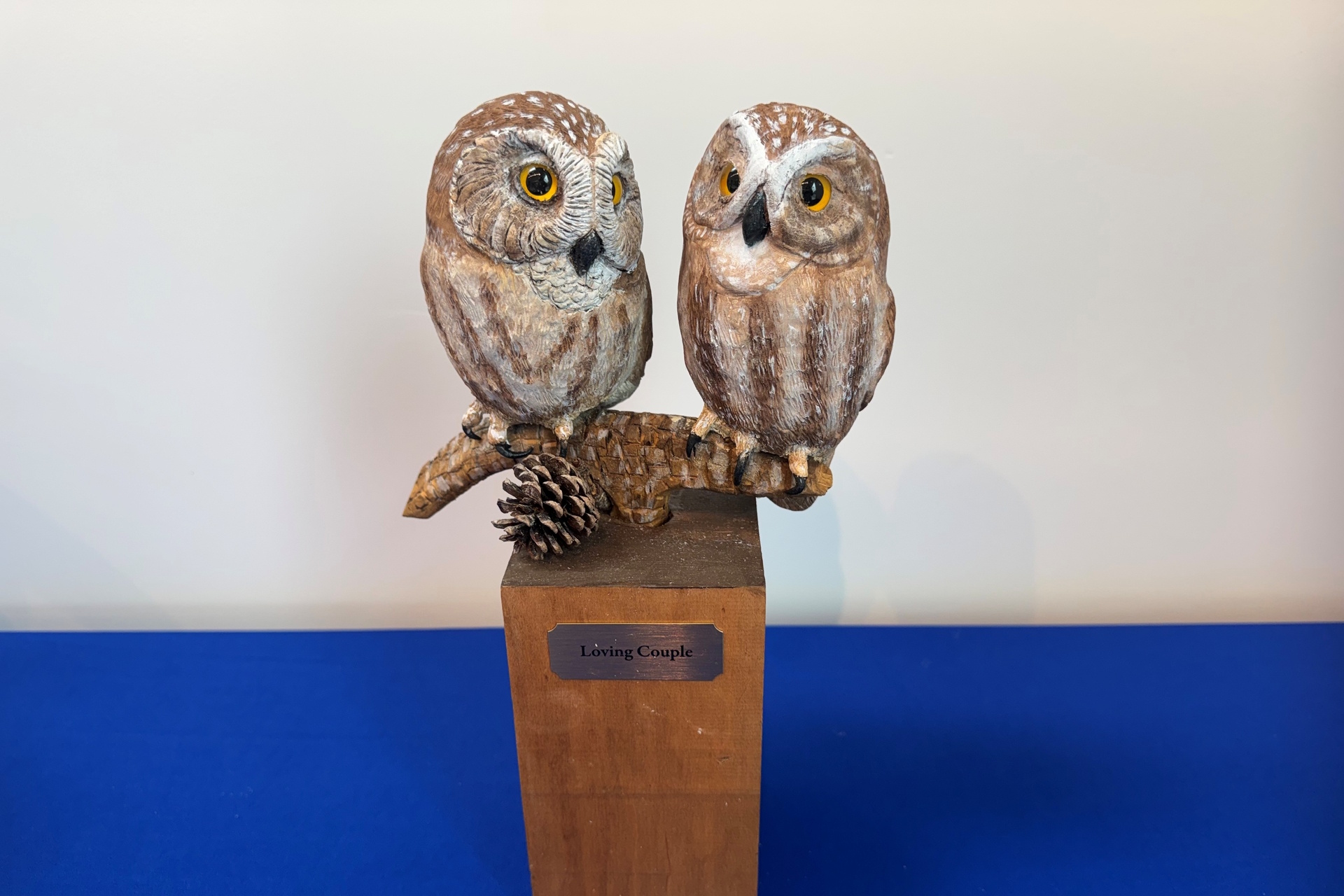 Sculpture featuring two Northern Saw-whet Owls, titled "Loving Couple"