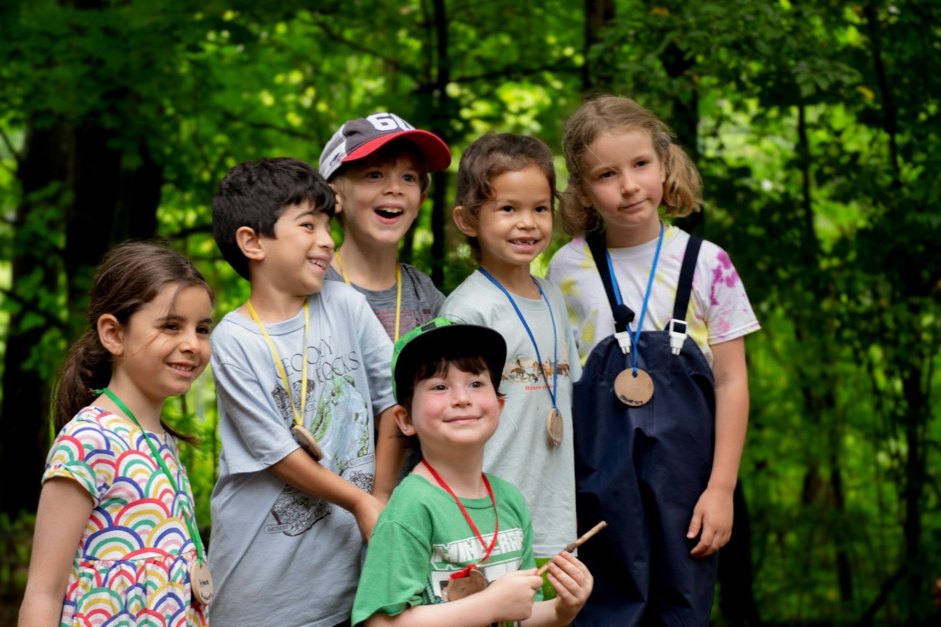 a group of 6 young campers smiling.