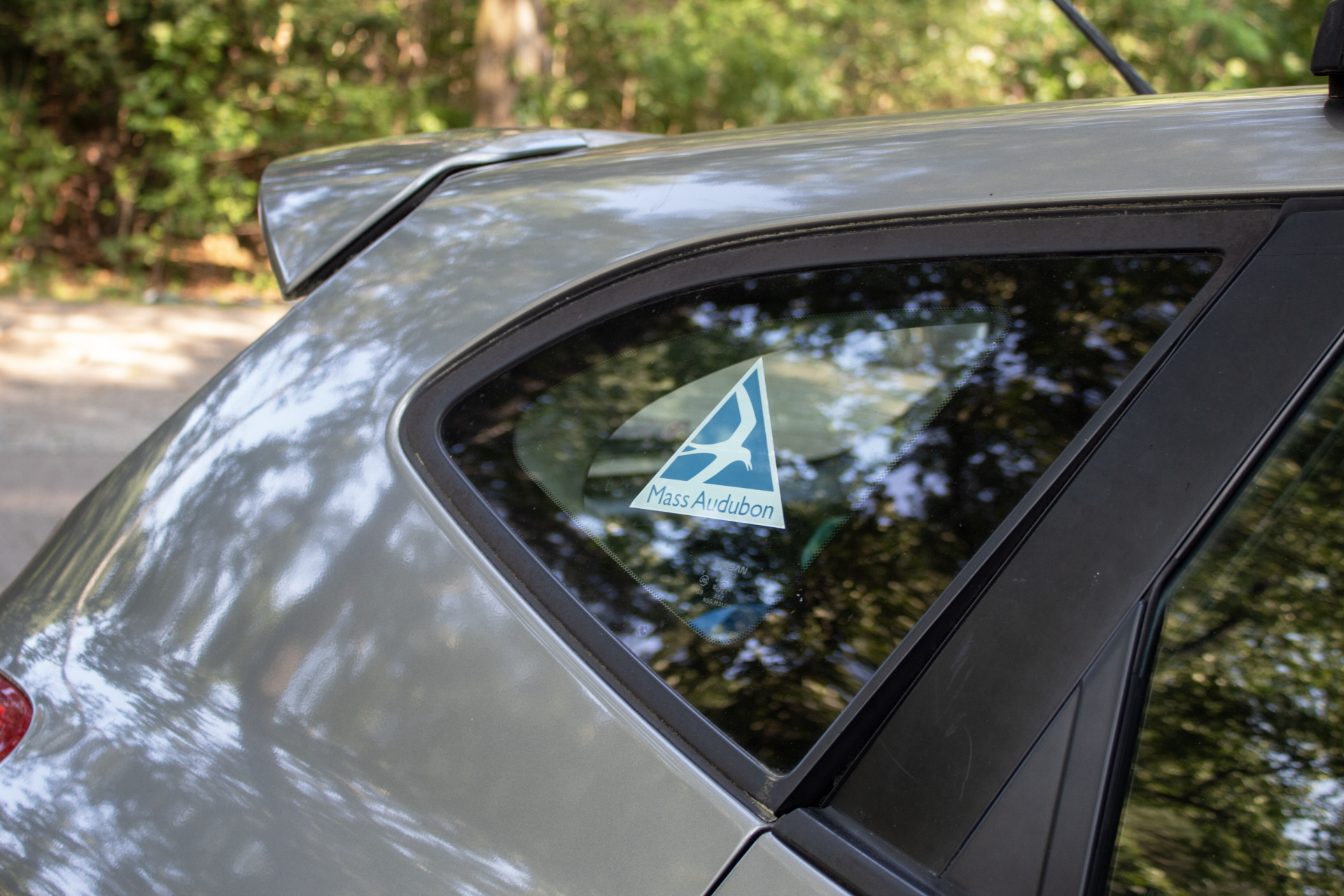 Mass Audubon decal on back of car window