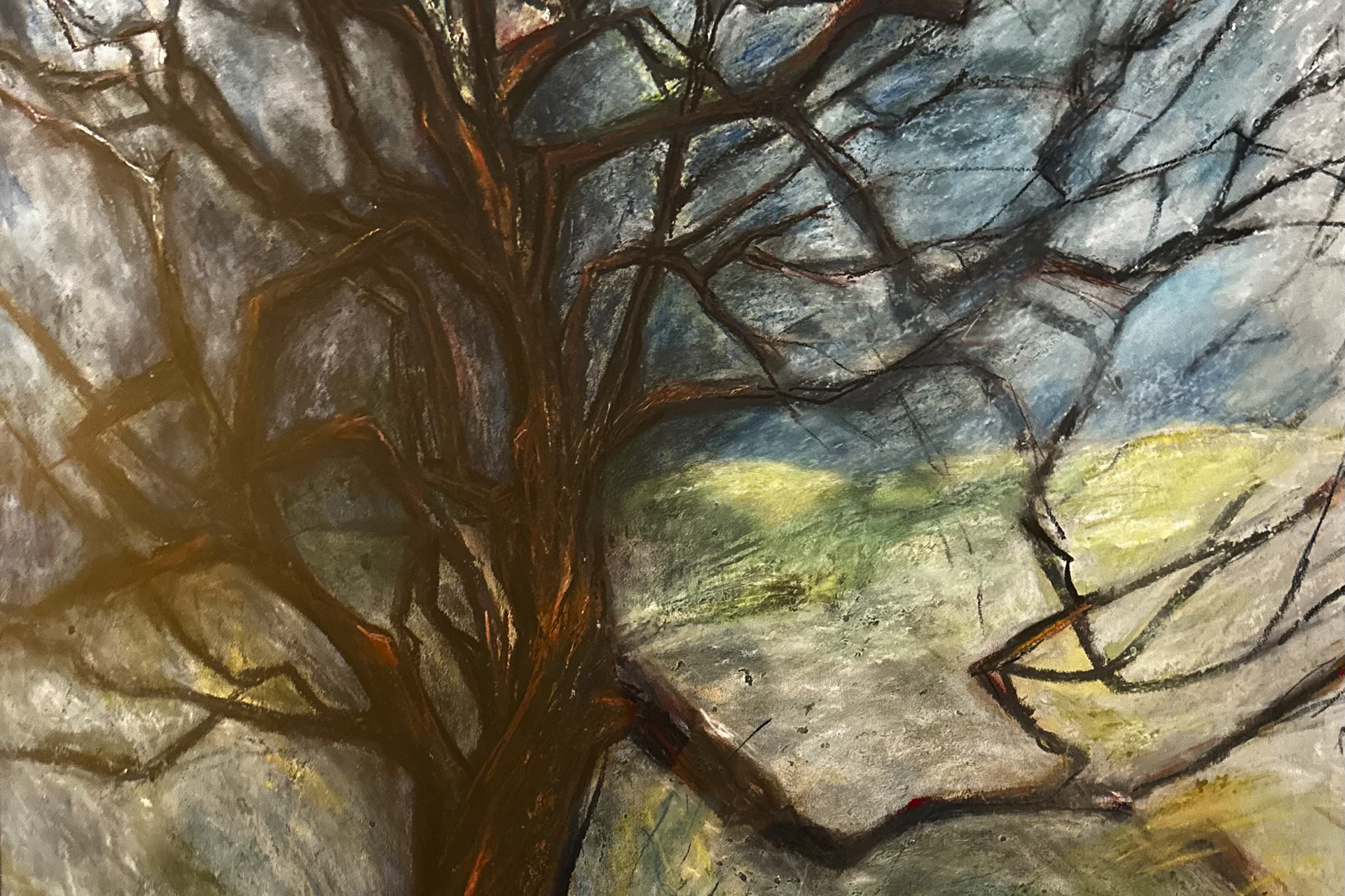Painting of a bare tree against green grass and blue sky