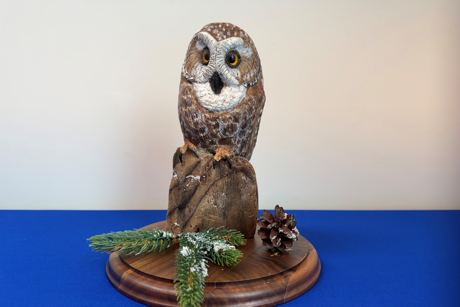 Sculpture featuring a roosting Northern Saw-whet Owl