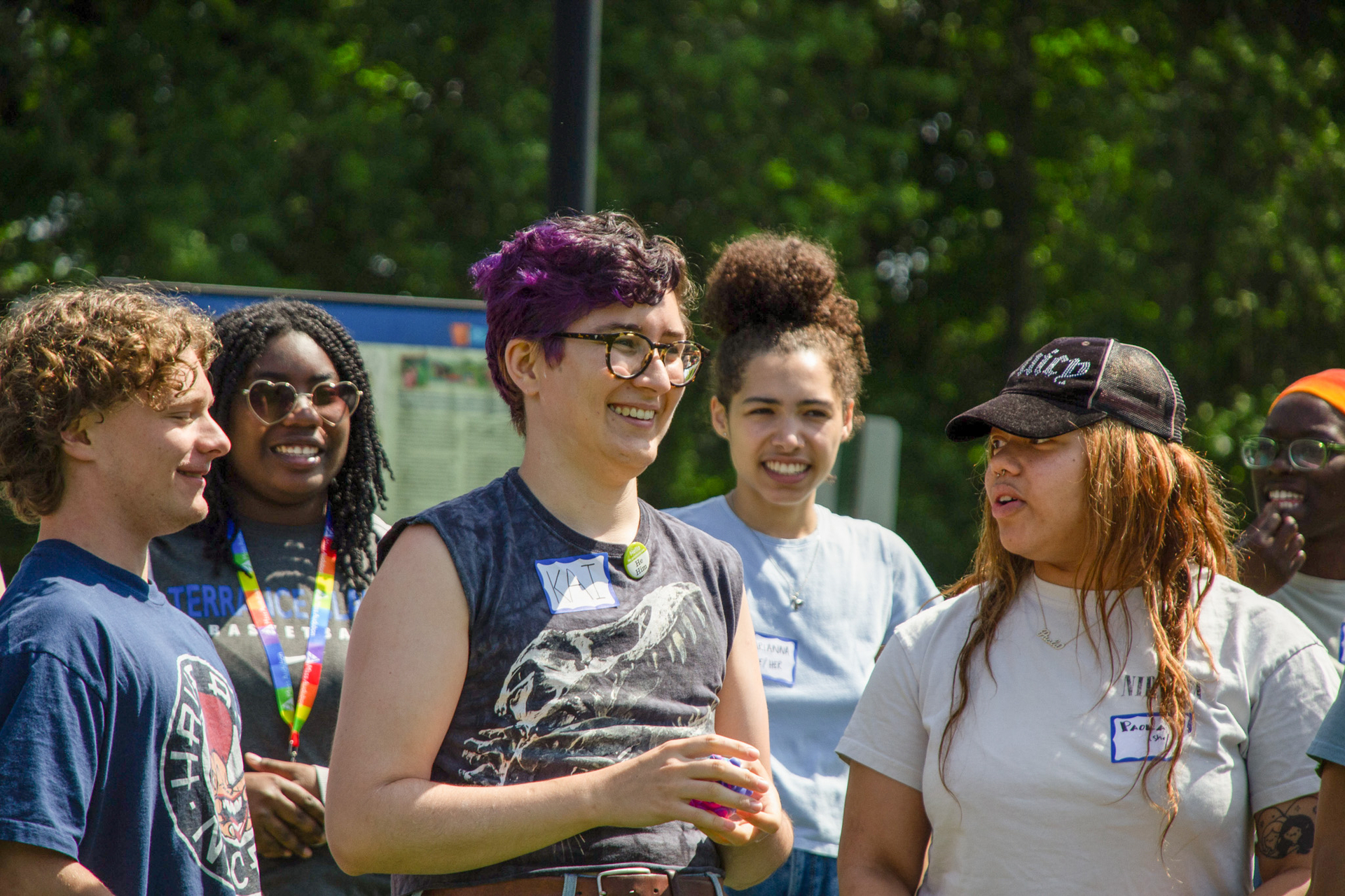 A group of six counselors stand smiling together.