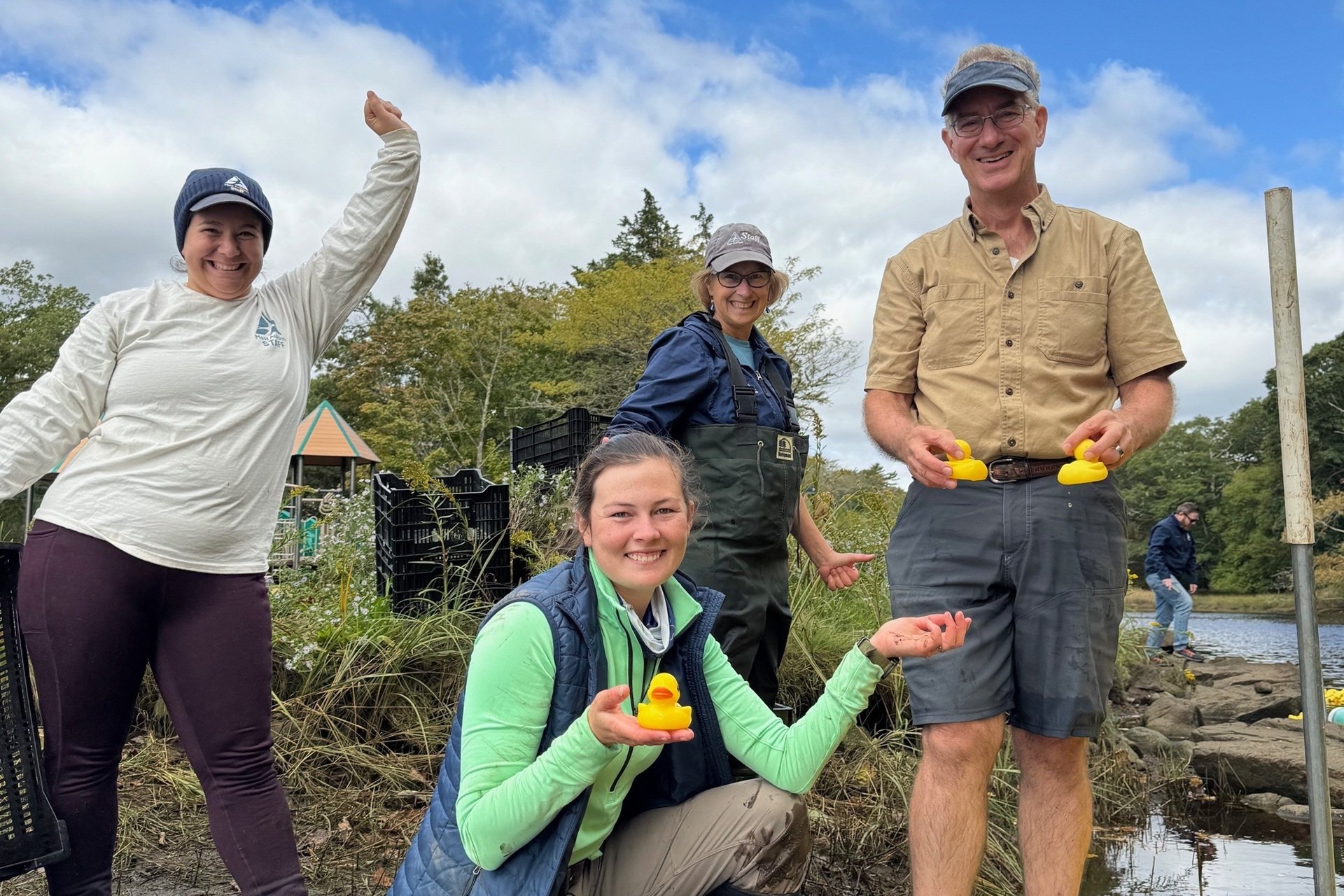 Staff posing with the winning Duck Derby racers (ducks)