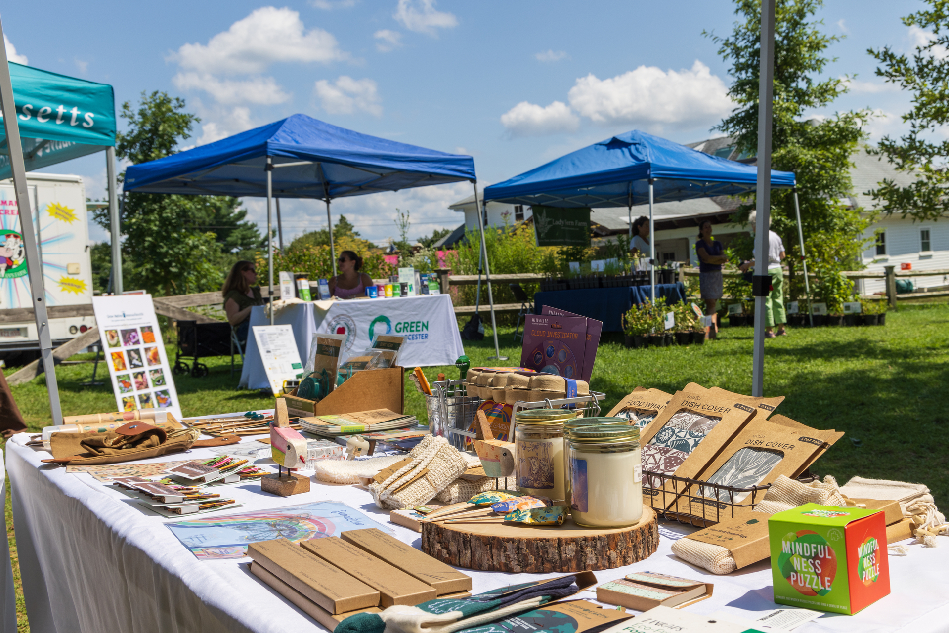 Vendor tables and tents offer eco-friendly wares.