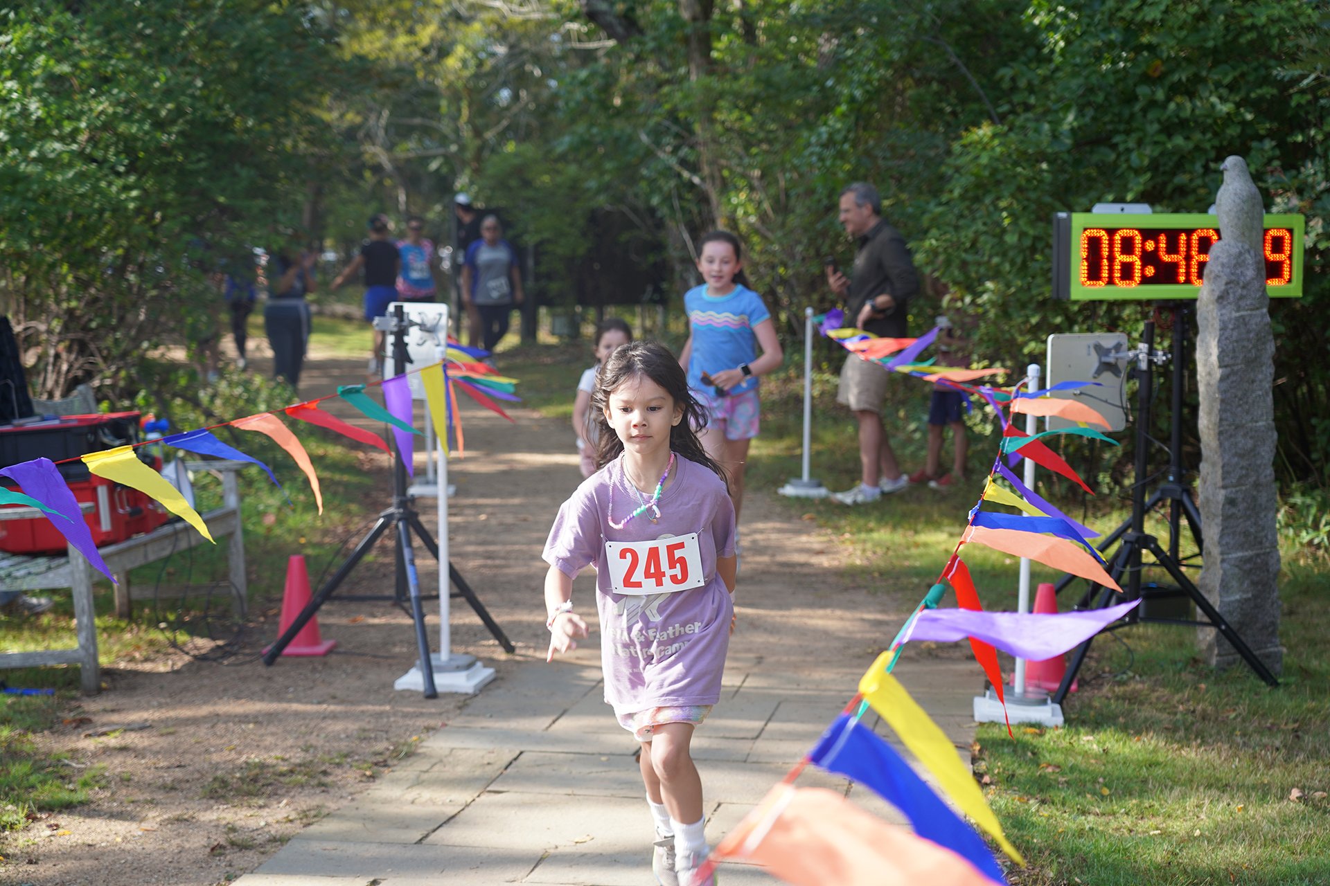 Child running in the Foot it for Felix race