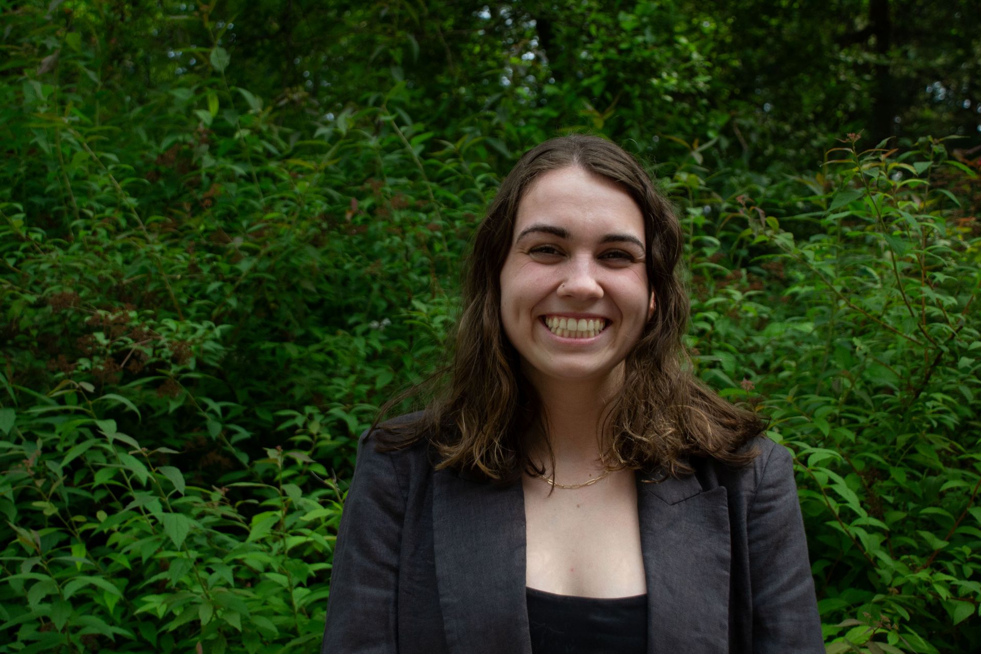 Hannah smiling, headshot.