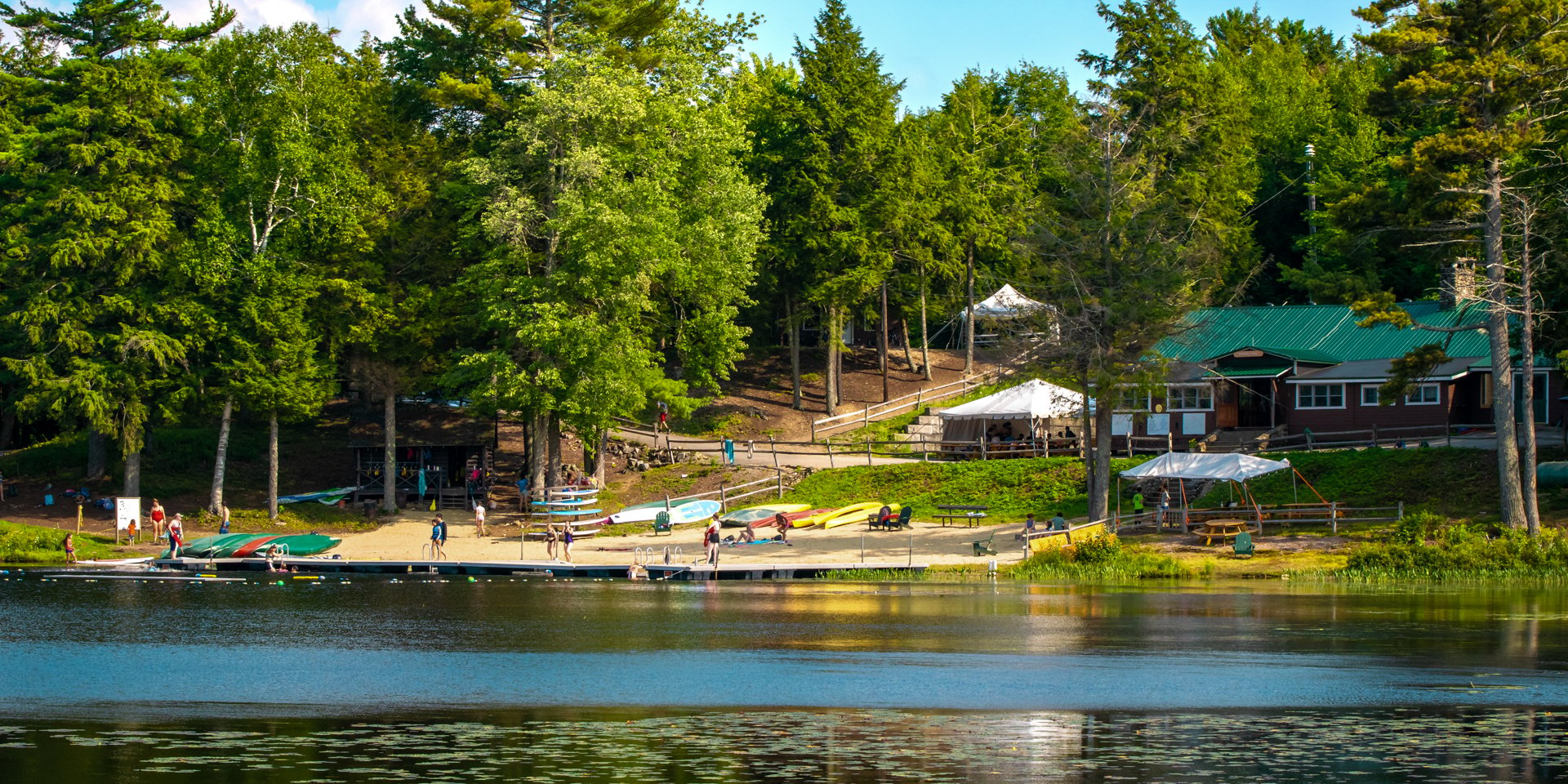 Looking back at the Wildwood waterfront and dining hall from across Hubbard Pond