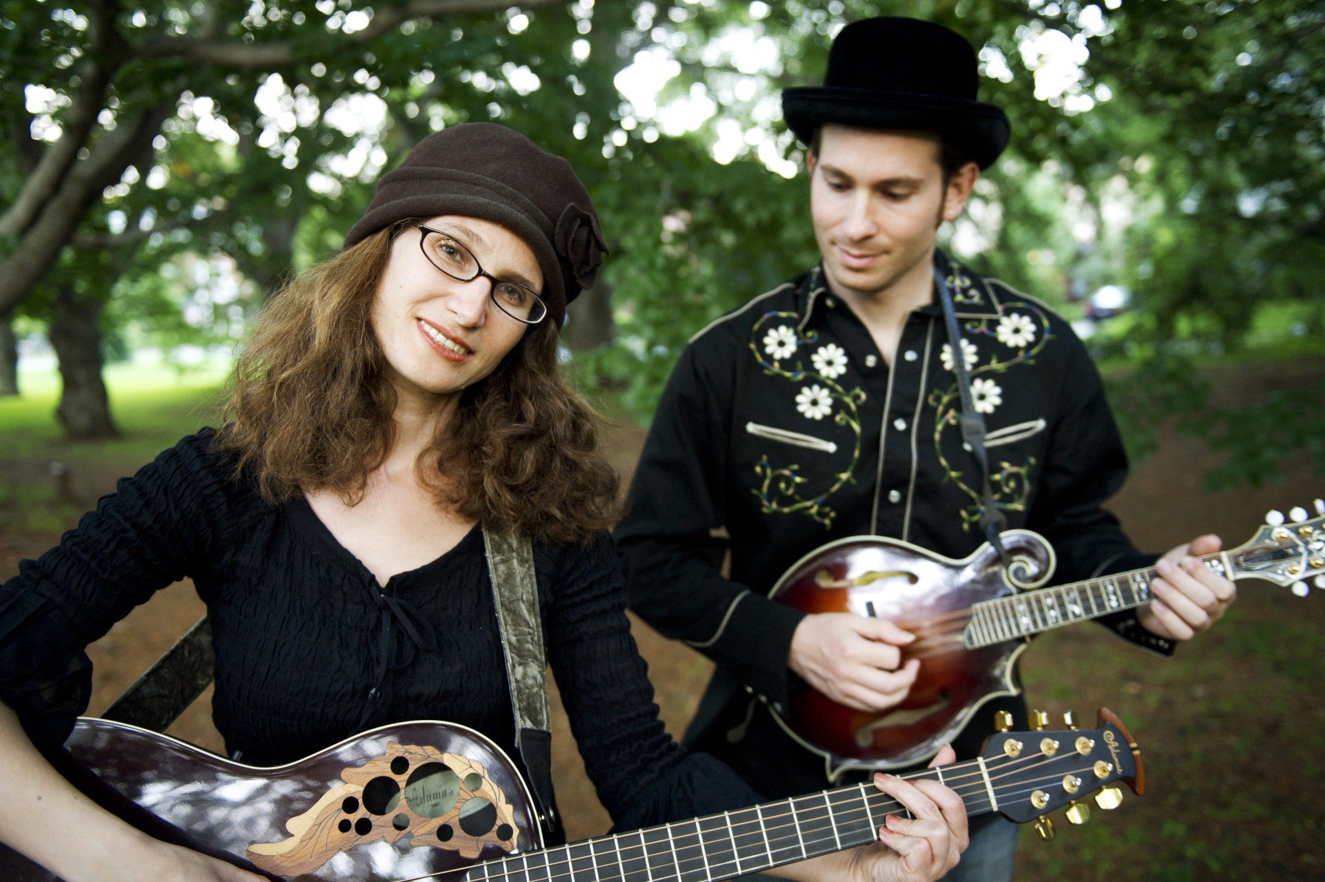 two people with string instruments