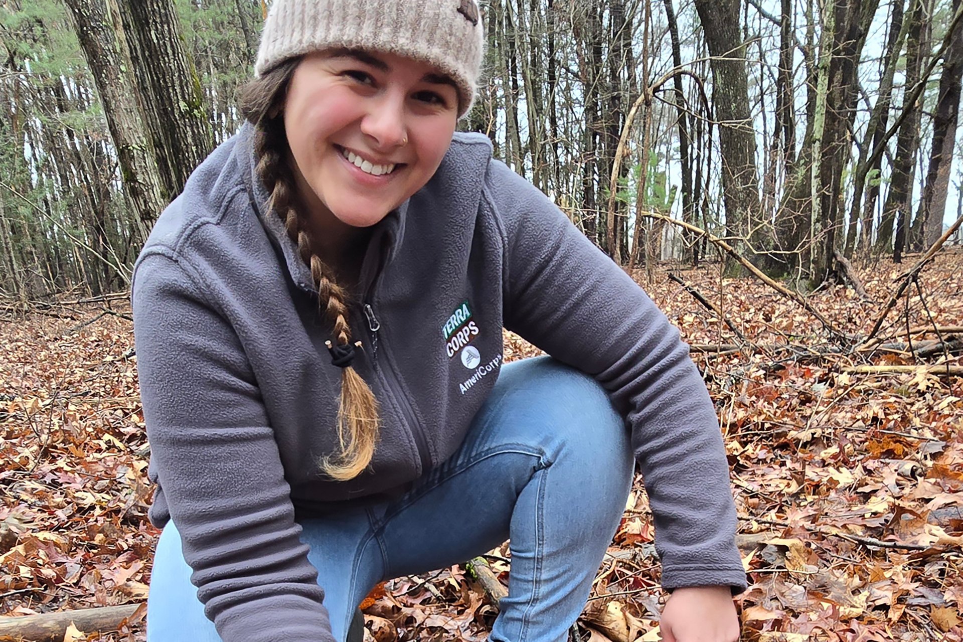 Andi Bickford kneeling over a survey site