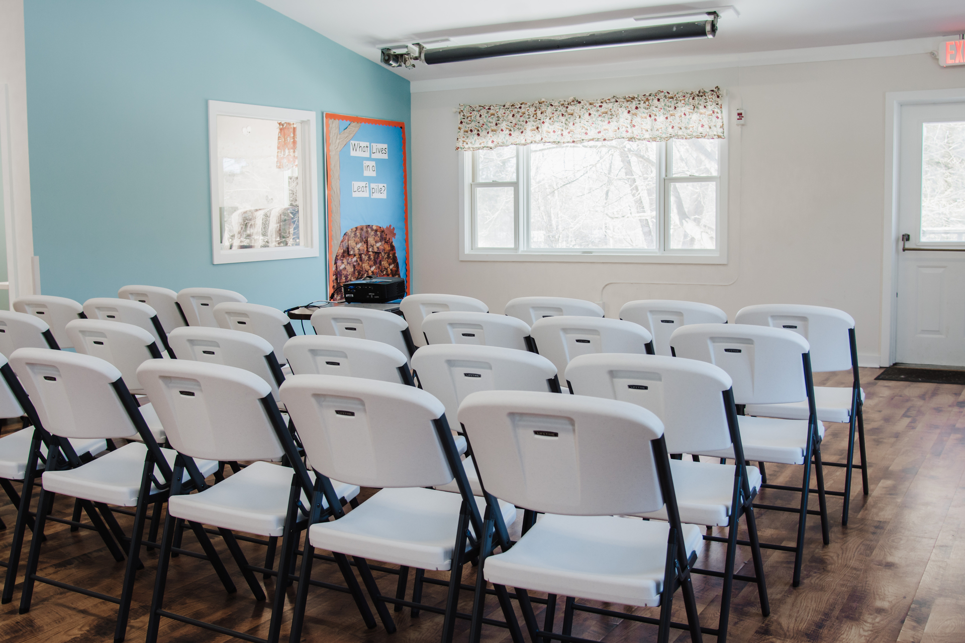 Auditorium set up with rows of chairs