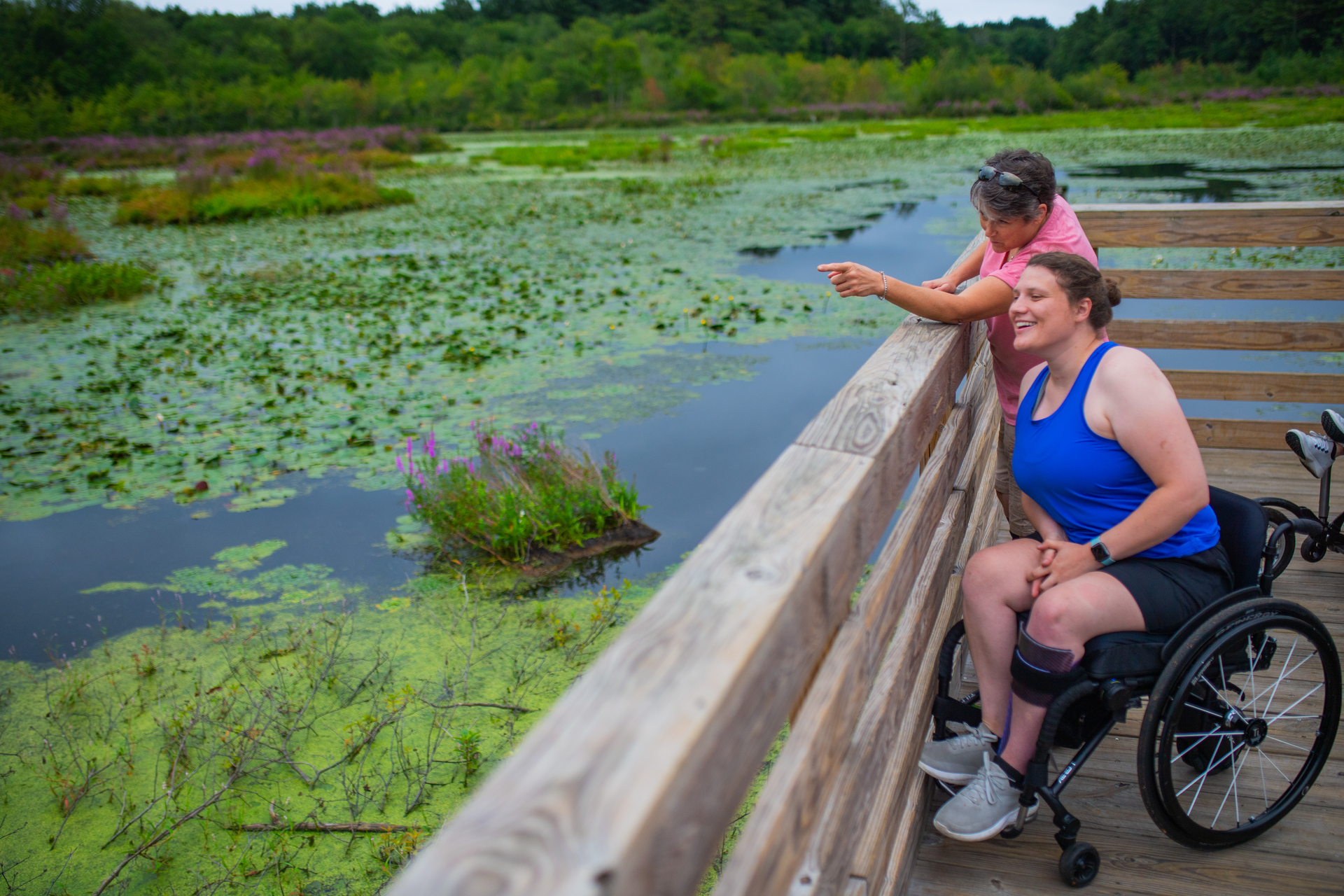 Two people on the boardwalk at Stony Brook