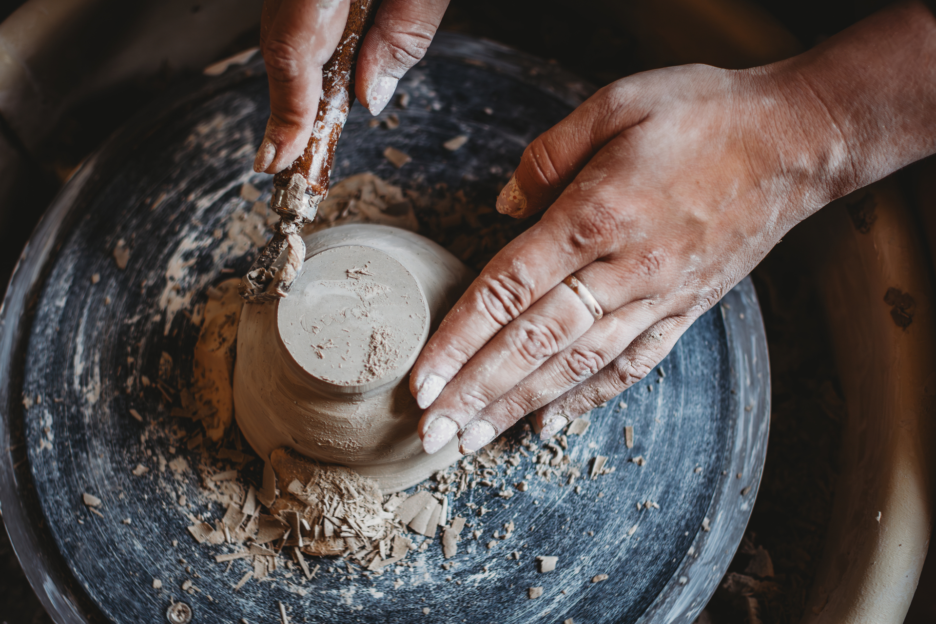 Carving pottery on a wheel