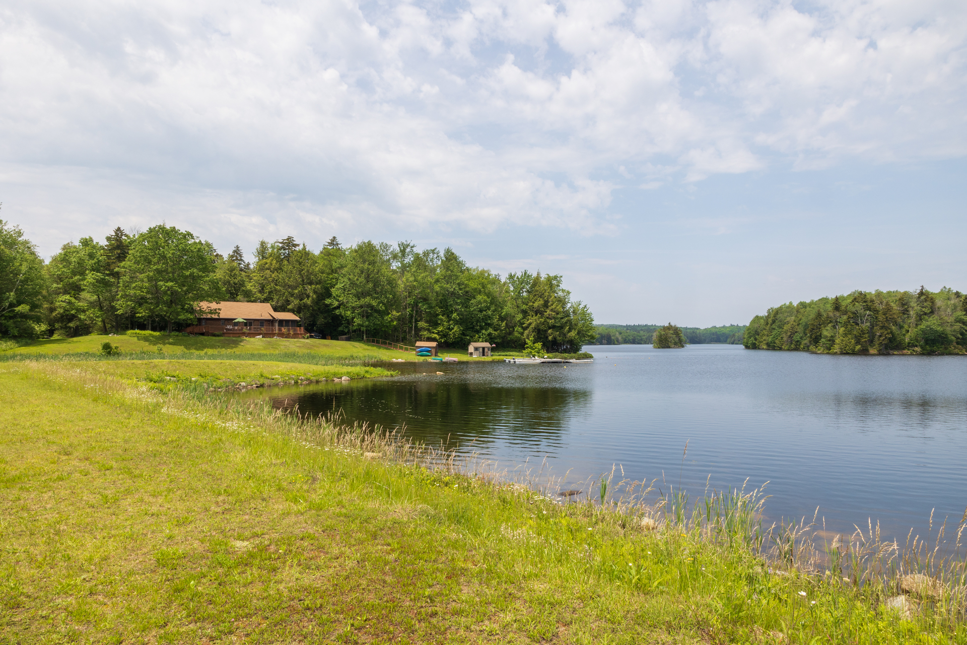 Canoe launch in the distance along the banks of a river