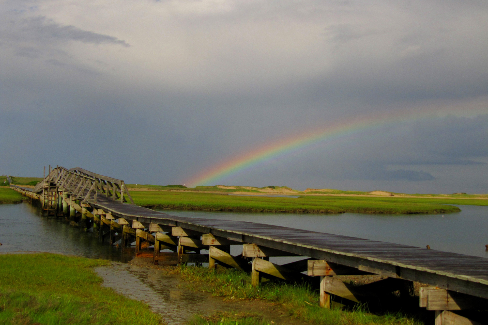 Rainbow over a boardwalk
