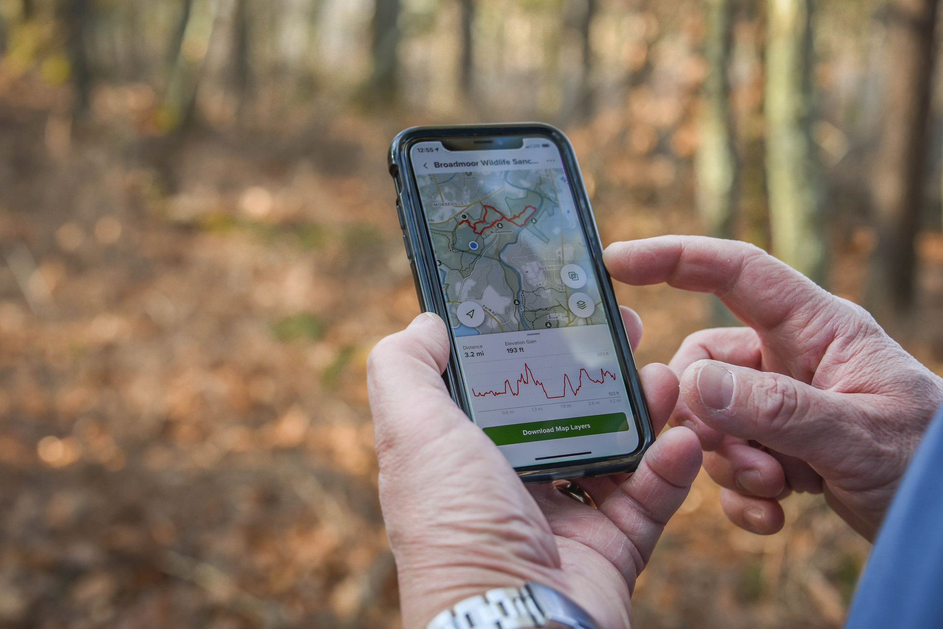 Hands using phone map