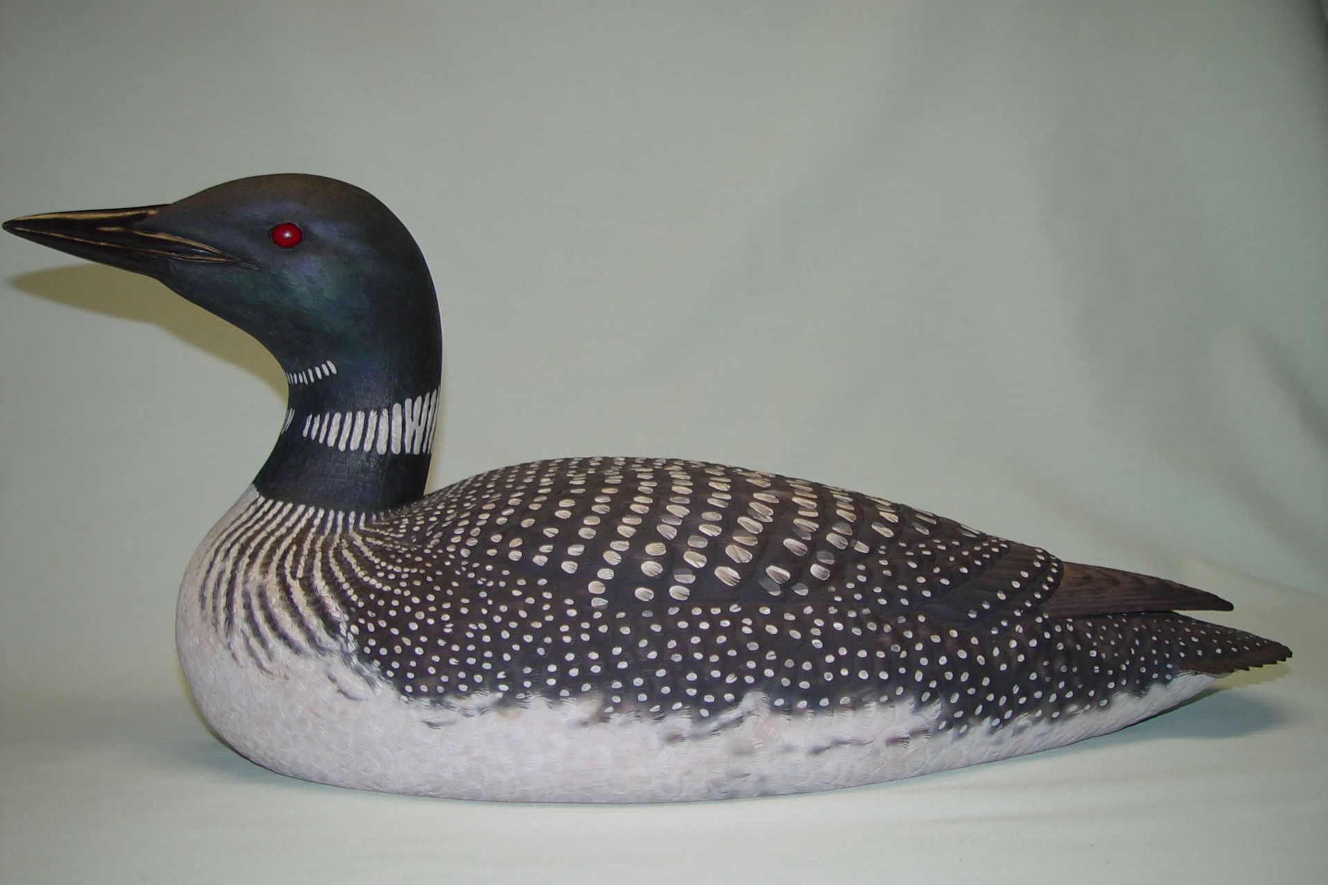 A wood carving of a Common Loon.