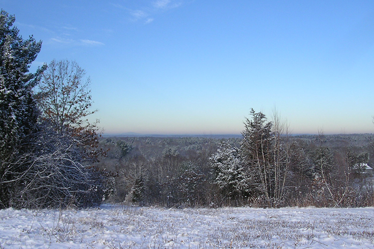View from the top of the drumlin in winter at Drumlin Farm Wildlife Sanctuary