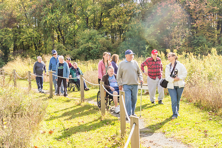 Group exploring an accessible trail at Arcadia Wildlife Sactuary