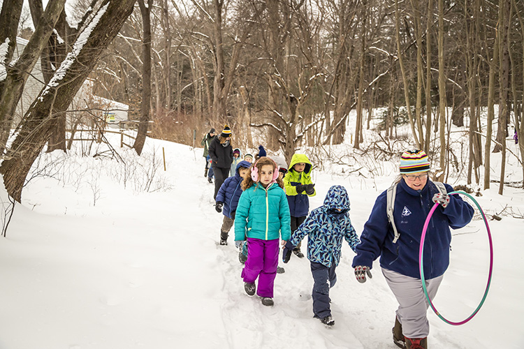 Kids outside in snow for a winter school vacation program at Arcadia Wildlife Sanctuary © Phil Doyle