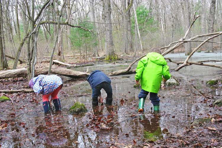 Playing in spring mud puddles at Habitat