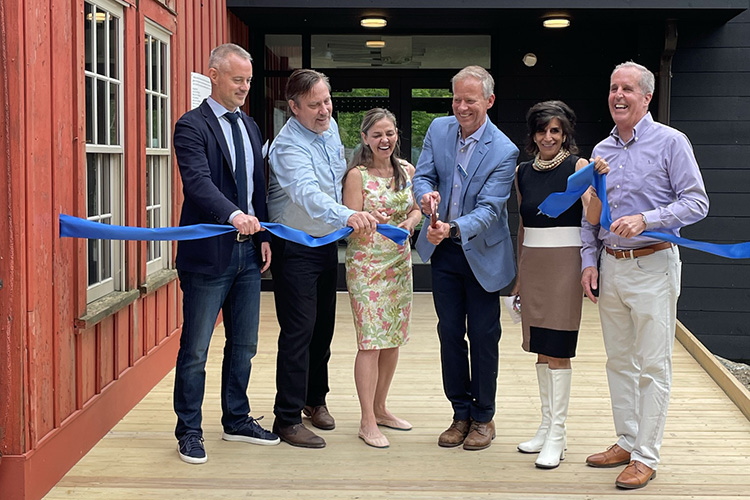 Cutting the ribbon at the entrance of the barn's new addition at Pleasant Valley Wildlife Sanctuary