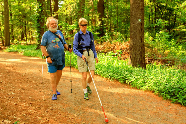 Two people walking on Pleasant Valley's All Persons Trail
