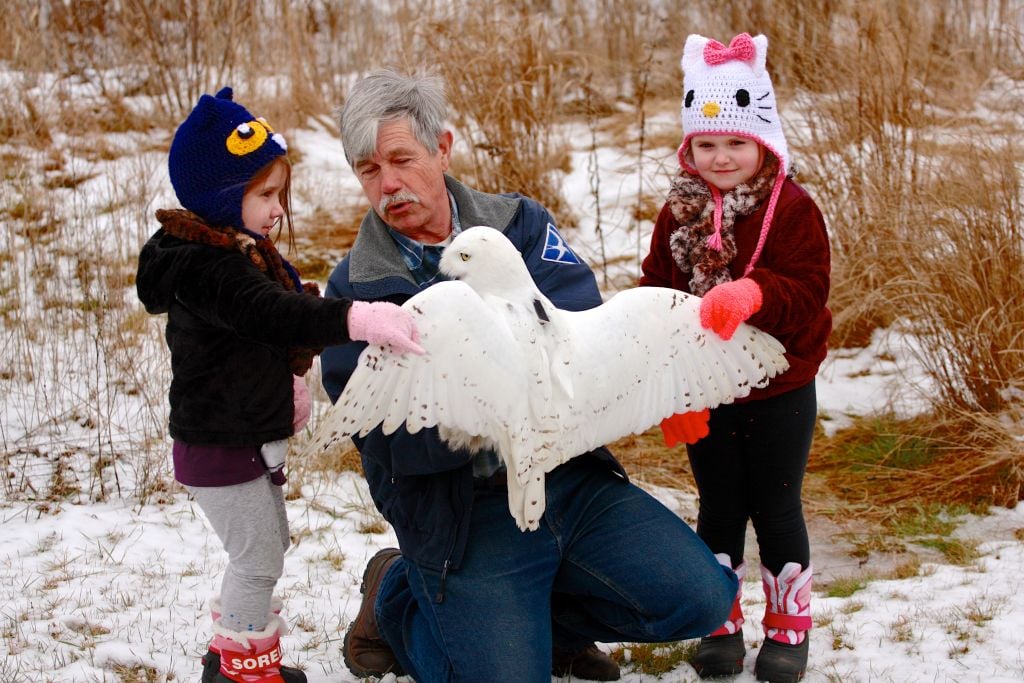Norm Smith with Snowy Owl and his grandkids 